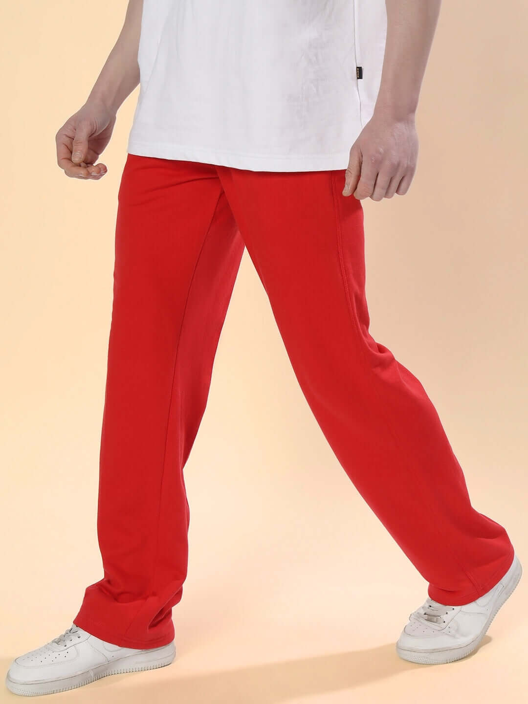 Person wearing DUDS LIMITED EDITION JOGGER in red, showcasing comfortable and stylish fit. Available for custom sizes.