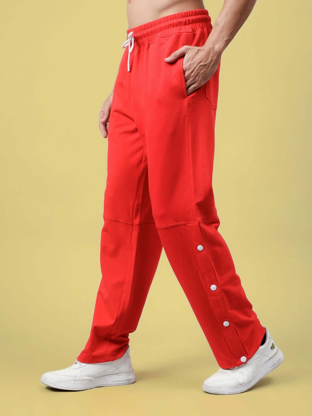 Model wearing red DUDS RACER JOGGERS, showcasing custom fit option and stylish button details, ideal for fashion-forward comfort.