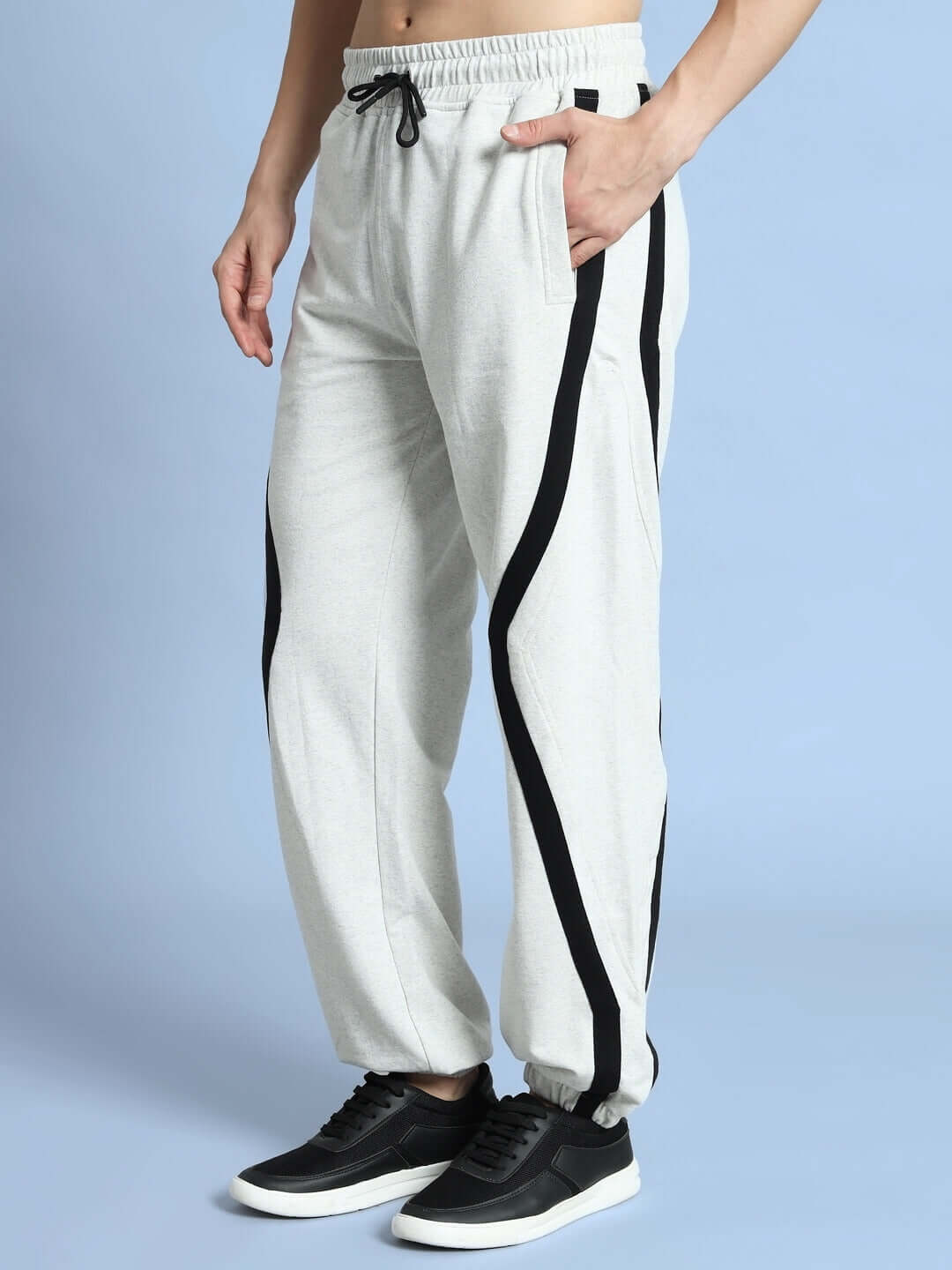 DUDS Frame Joggers in Melange Grey with black stripes, comfortable fit made by DUDS Tailors, highlighting customizable options.