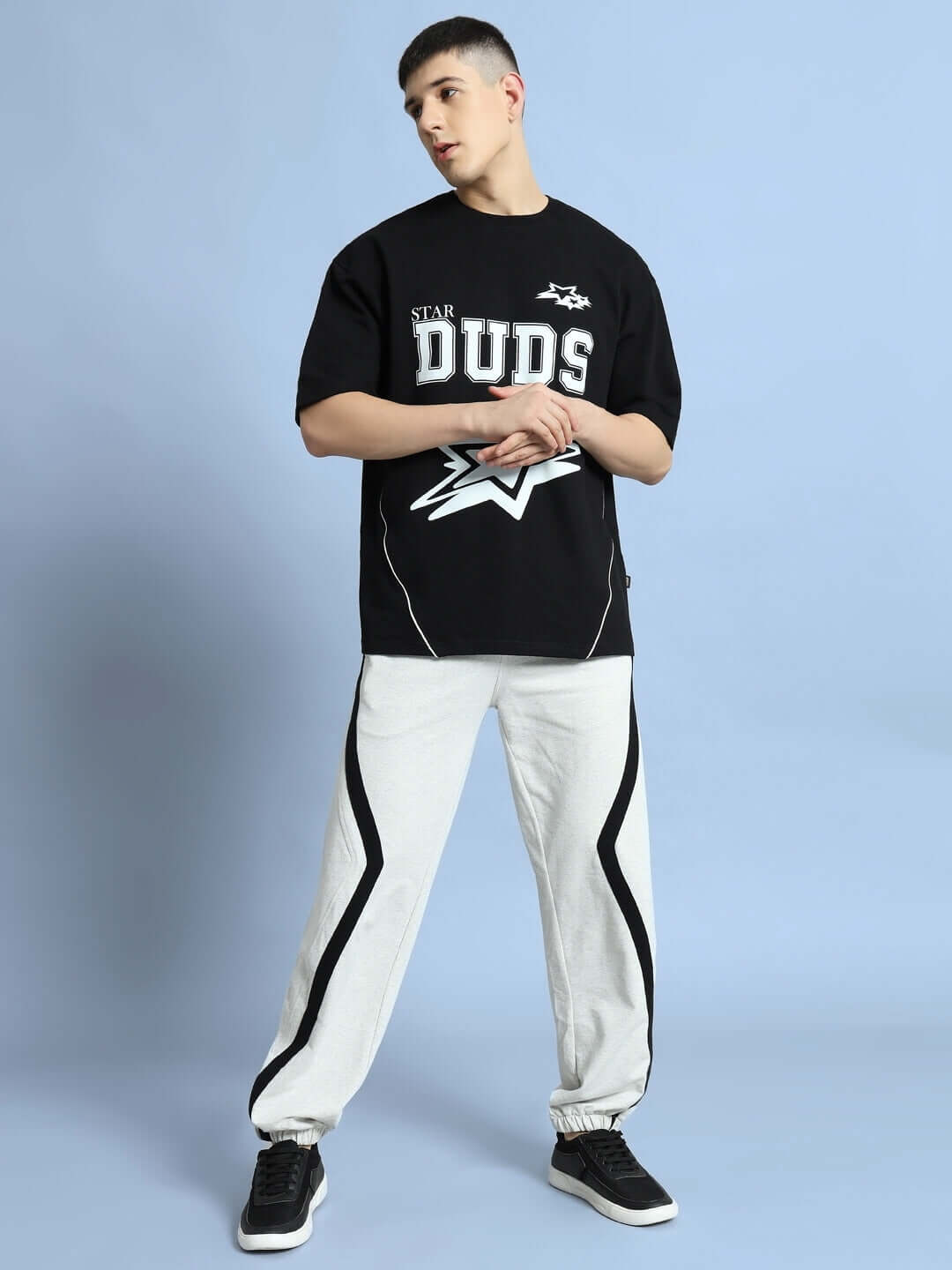 Model wearing DUDS FRAME JOGGERS in Melange Grey, made to order with custom fit options, showcasing modern streetwear style.