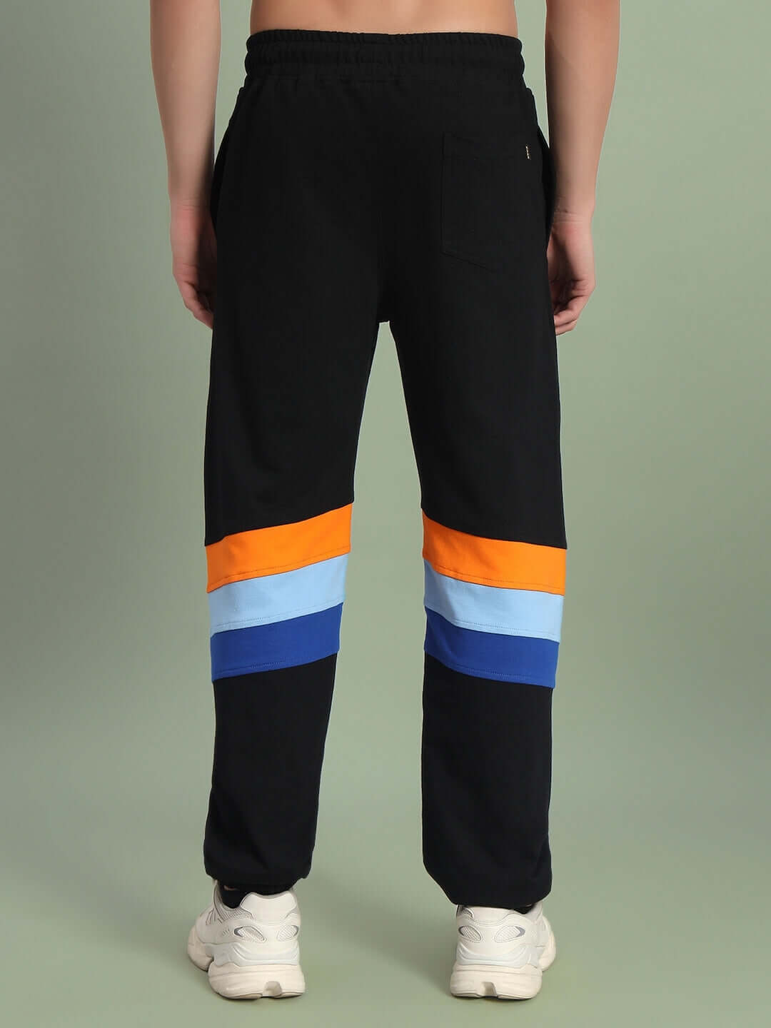 Rear view of DUDS Jasper Joggers in black with colorful stripes, made to order for custom fit.