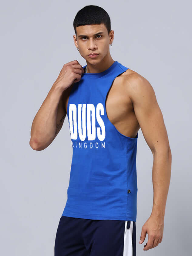 Man wearing DUDS KINGDOM GYM SLEEVELESS T-SHIRT BLUE showcasing fitness style and comfort.