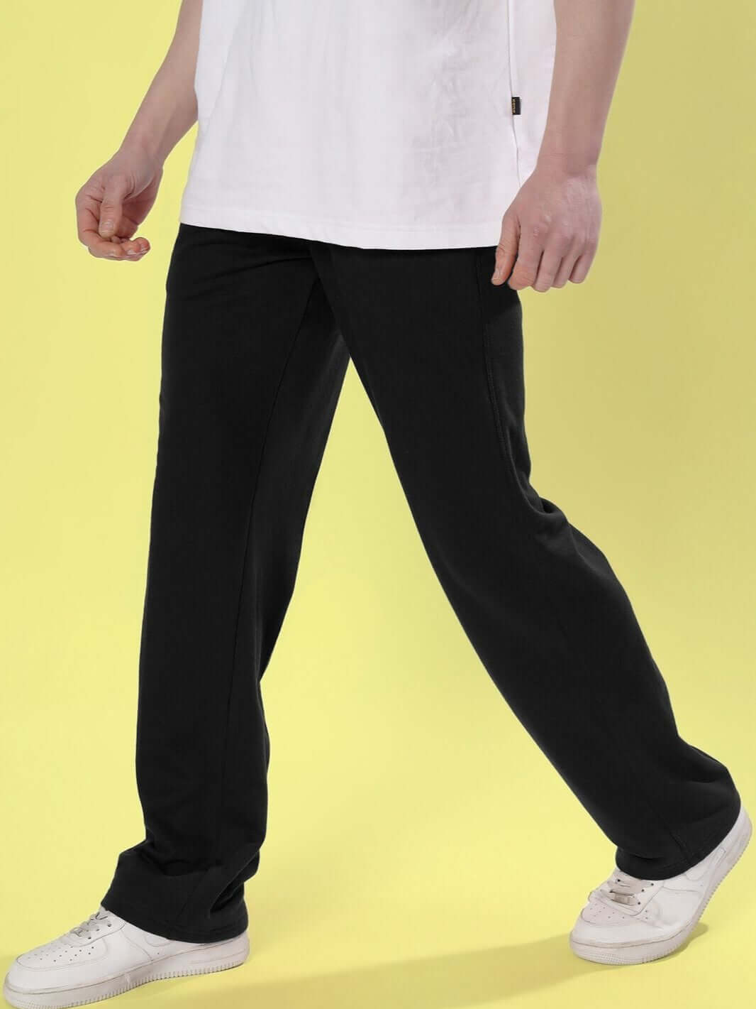 Side view of a person wearing DUDS Limited Edition Black Jogger, showcasing comfort and style, available for custom fit.