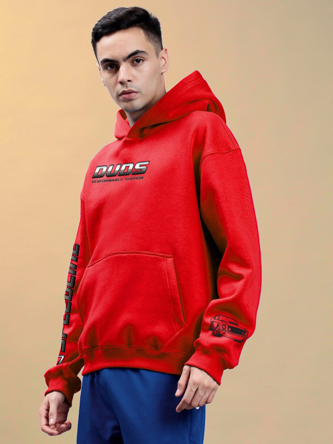 Man wearing DUDS PERFORMANCE MUSTANG PRINTED HOODIE RED with Mustang graphic, showcasing bold streetwear style and comfort.