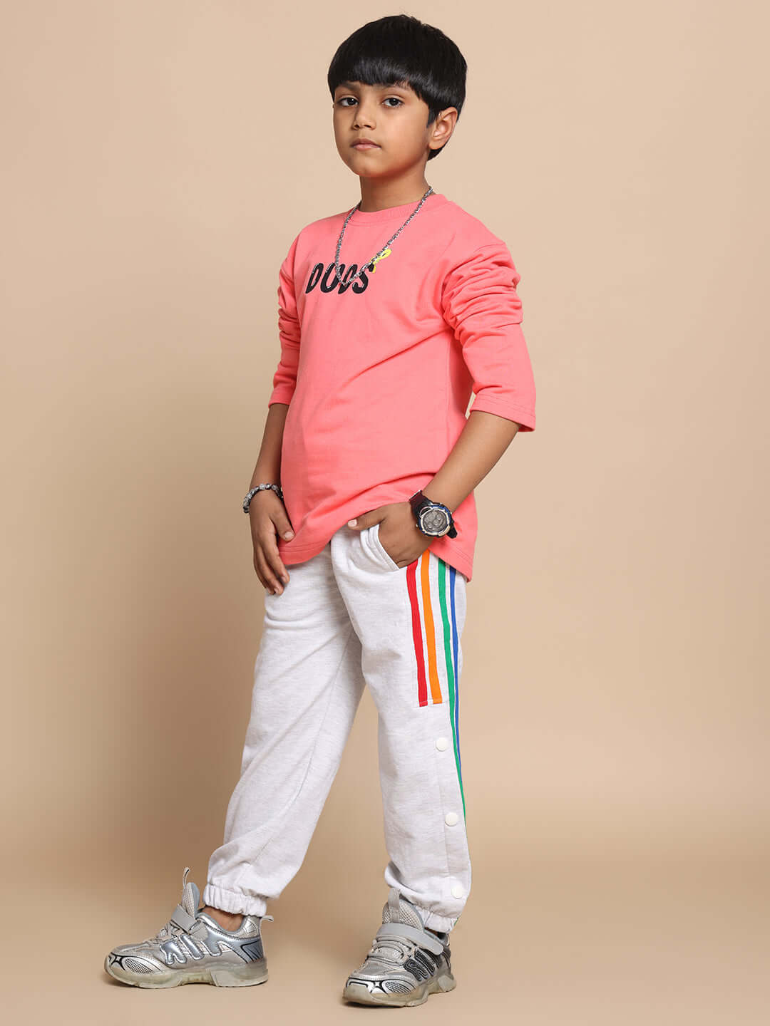 Child wearing DUDS Prism Colorful Stripe Jogger in Melange Grey, styled with a vibrant top, showcasing trendy casual wear for boys and girls.