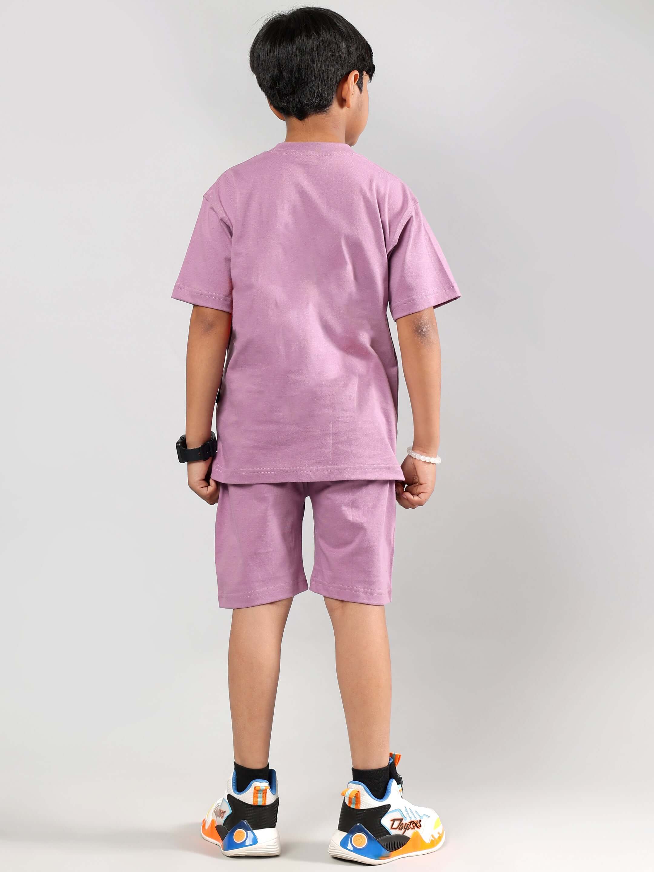 Child wearing plum purple DUDS Street Co-Ord set, standing with back view. Ideal for boys and girls. Customizable and made to order.