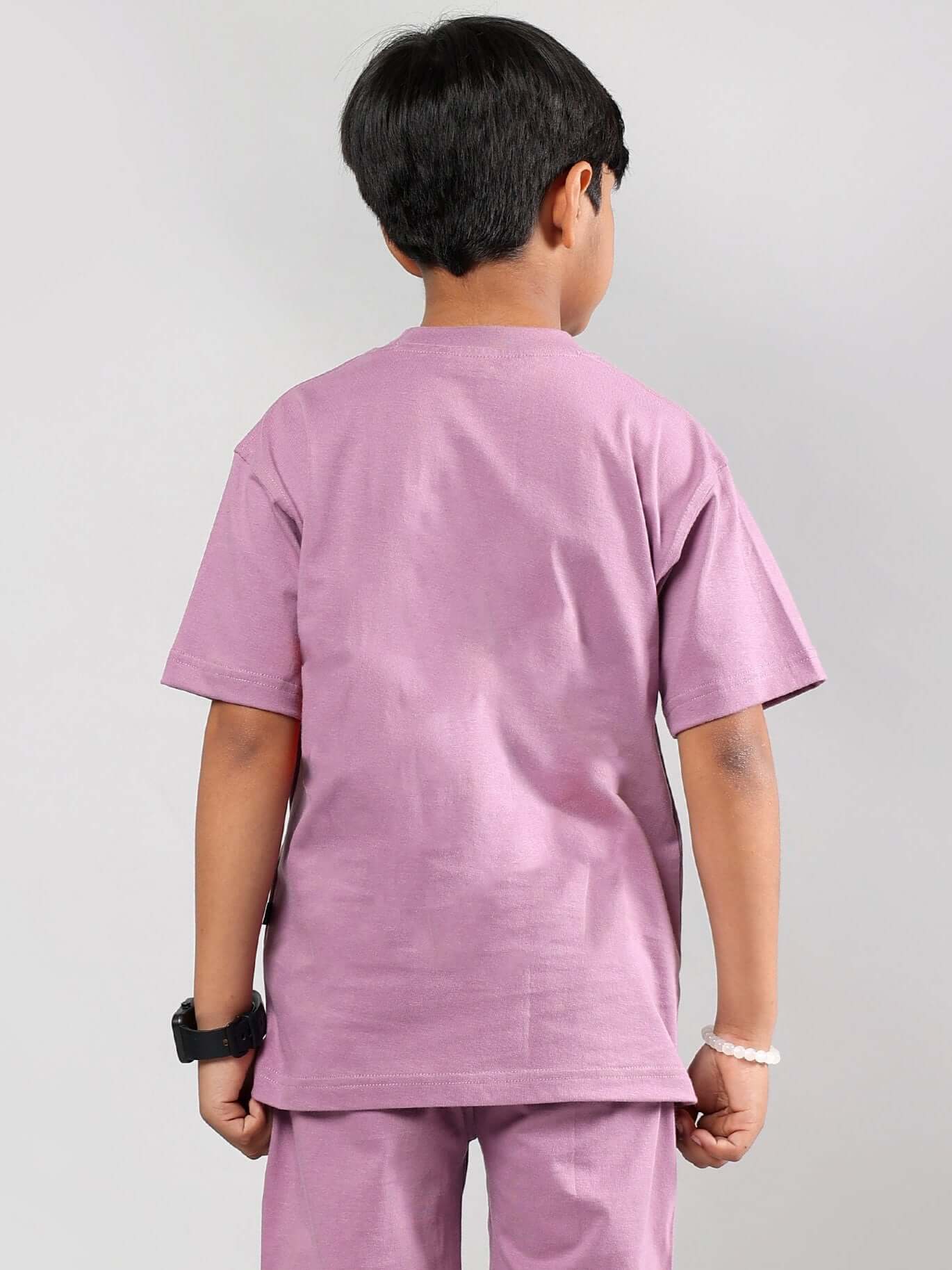 Rear view of child wearing DUDS plum purple printed t-shirt, suitable for boys and girls, customizable size available, made to order.