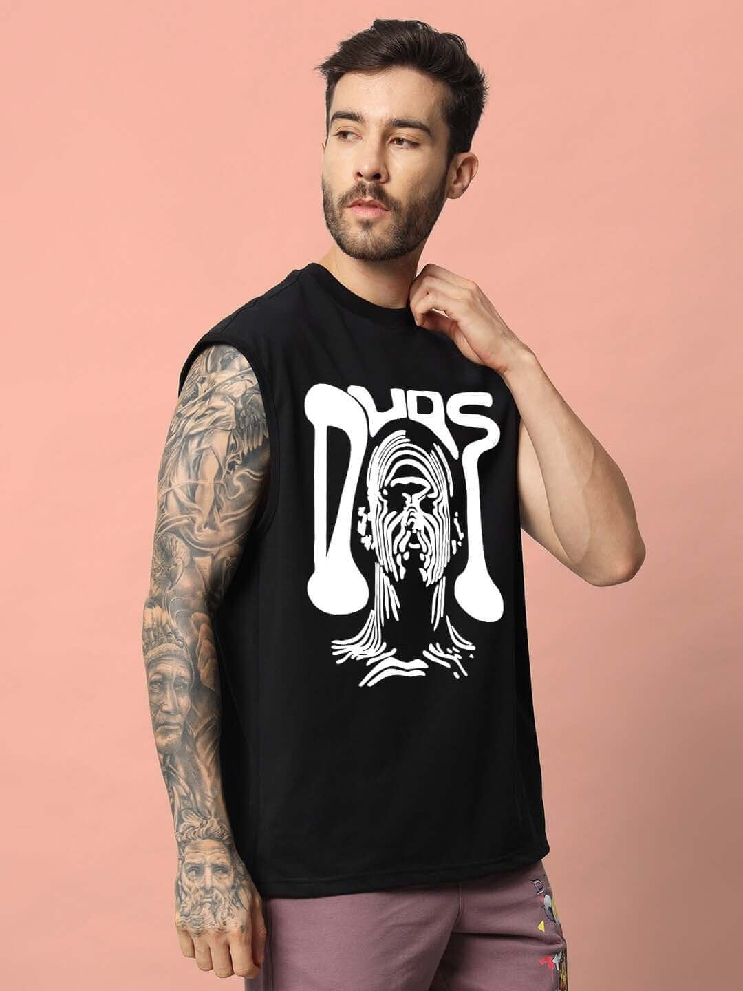 Man wearing DUDS Taska Gym T-Shirt in black featuring bold white graphic design, ideal for workouts and casual wear.