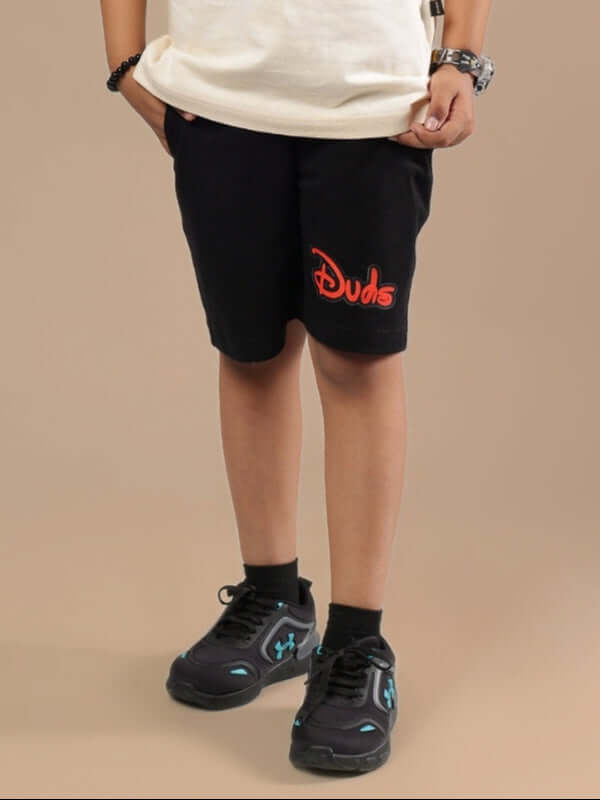 Child wearing DUDS MOUSE SHORTS FOR BOYS & GIRLS BLACK, stylish and comfortable, made to order by DUDS Tailors.