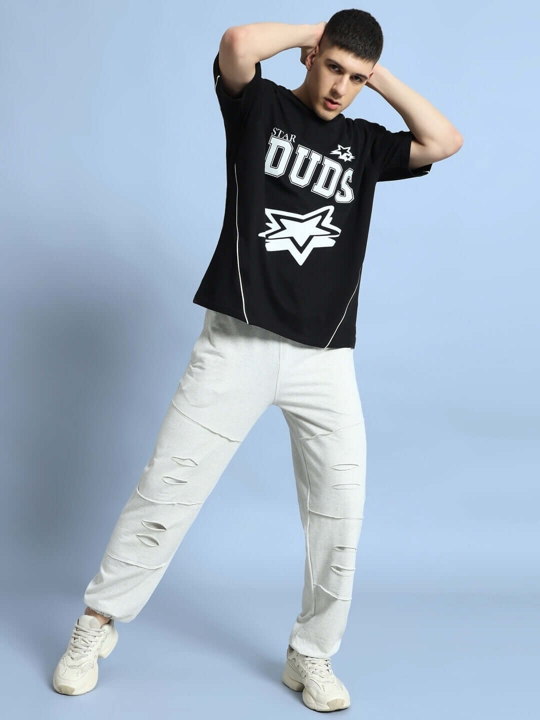 Model wearing melange grey DUDS Graze Joggers paired with a black DUDS t-shirt, showcasing casual style and comfort.
