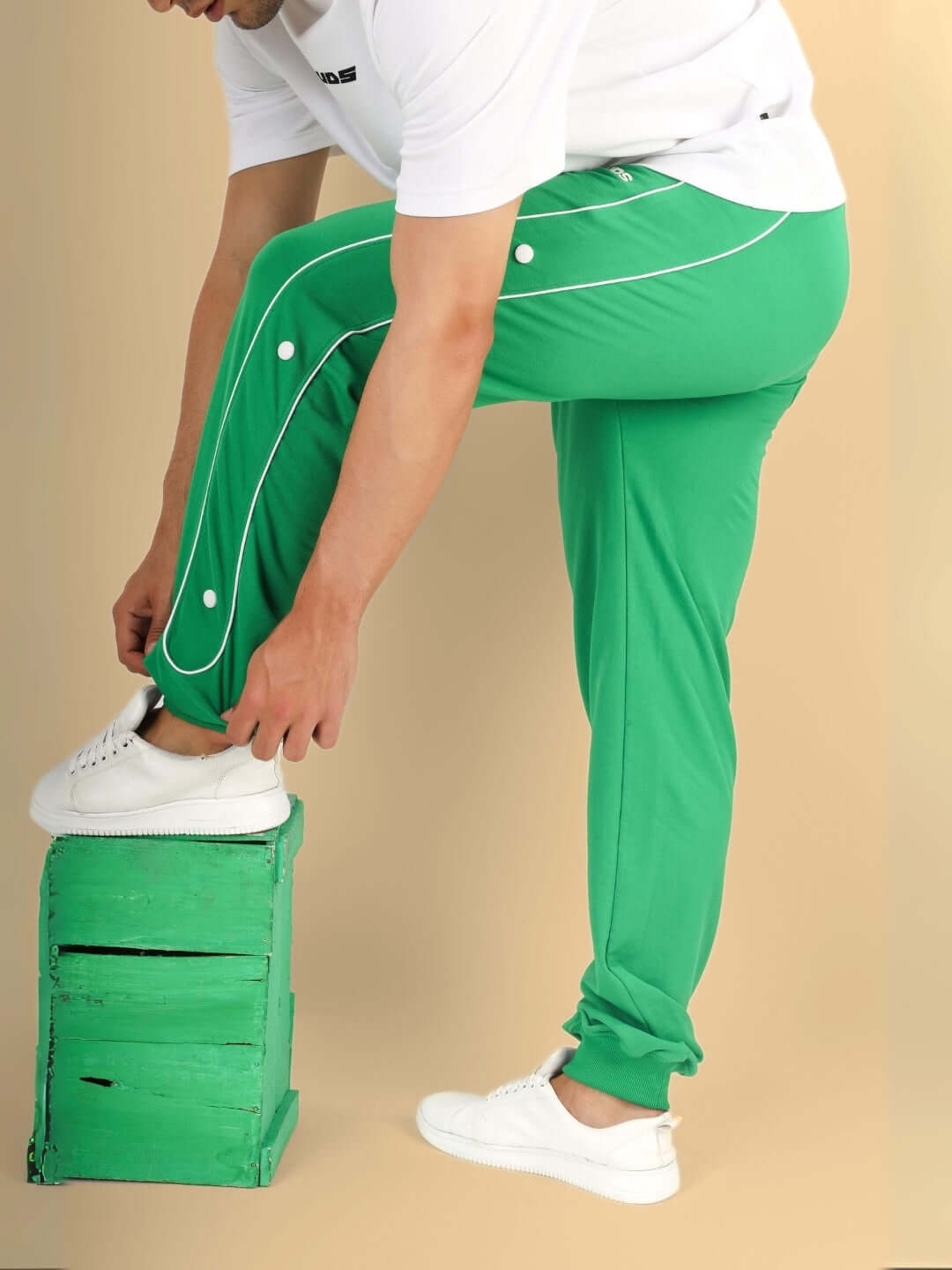 Model wearing green DUDS MOON NIGHT joggers, highlighting the sleek design and comfortable fit, ideal for nighttime activities.