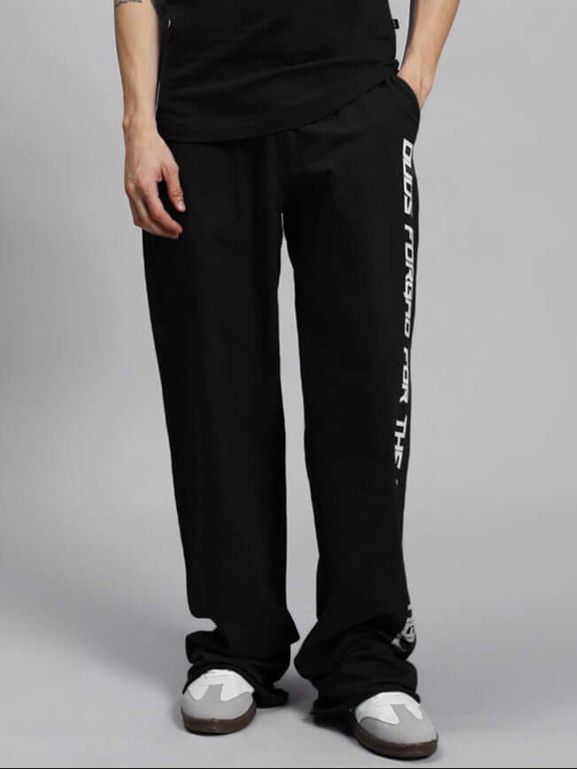 Man wearing DUDS SWIFT JOGGER COTTON TERRY BLACK trousers, showcasing comfortable fit.