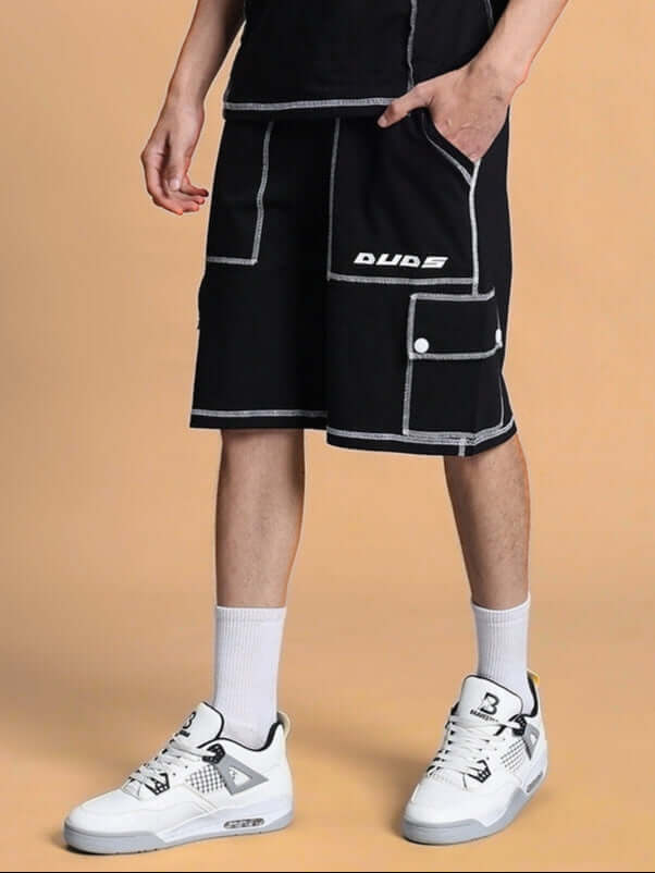 DYNAMIC REGULAR FIT SHORTS BLACK worn by model, featuring sporty design with white sneakers, showcasing comfort and style for all-day wear.