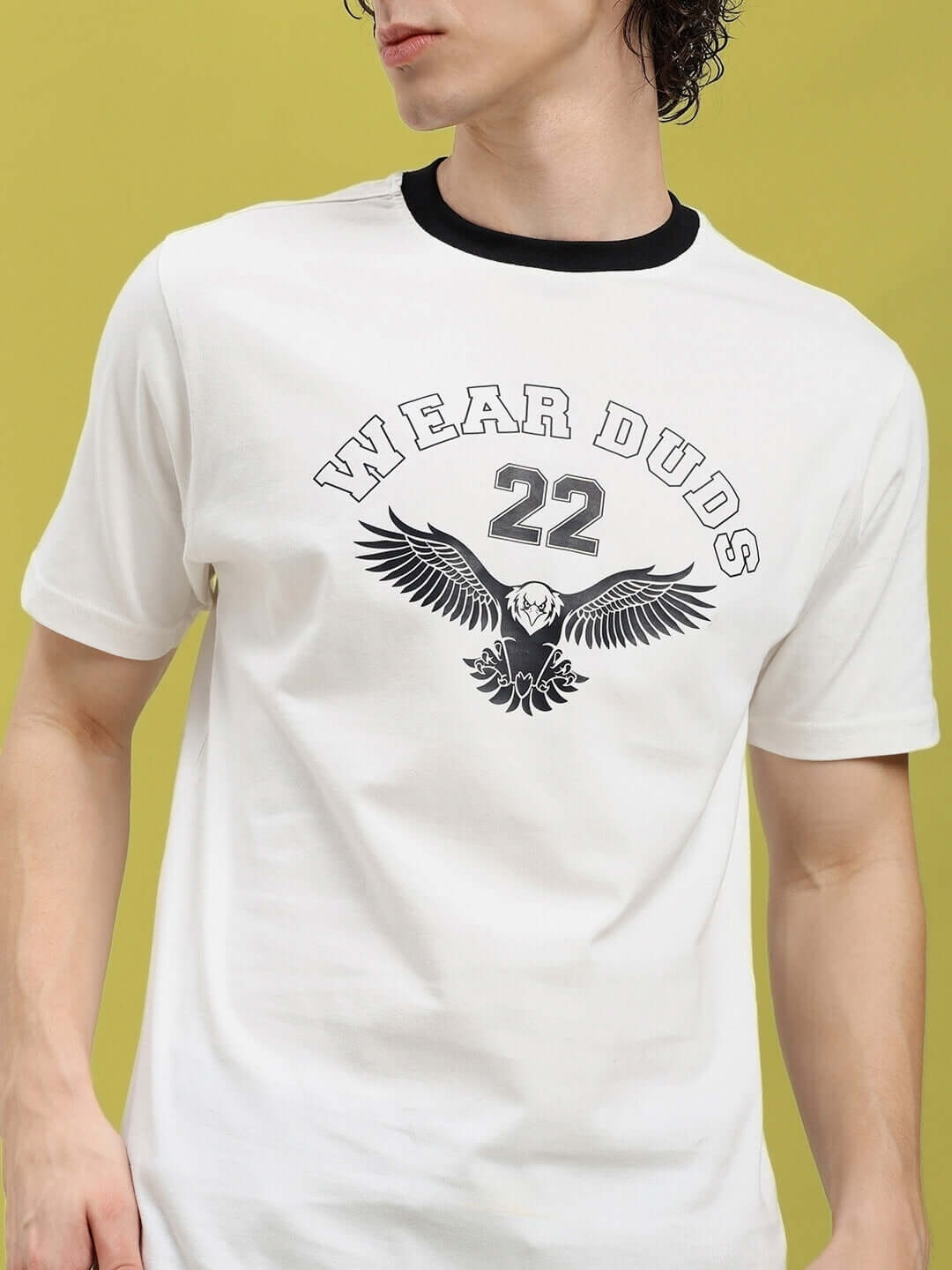 Model wearing Eagle Wings regular fit white T-shirt with graphic design, 100% cotton, premium heavy gauge fabric, front view.