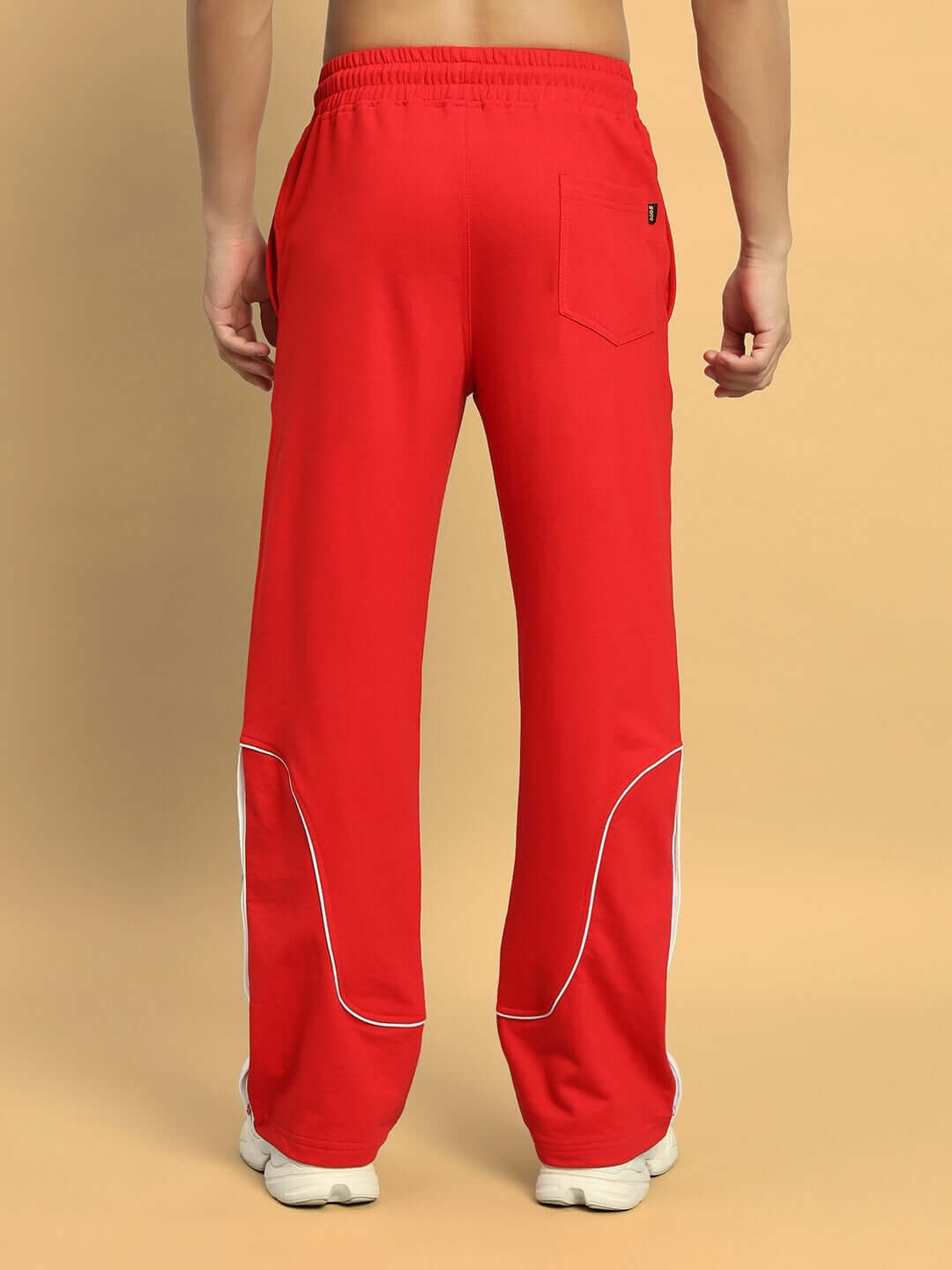Back view of EDDIE CONTRAST JOGGERS in red, showcasing white piping detail and comfortable fit, custom fit available.