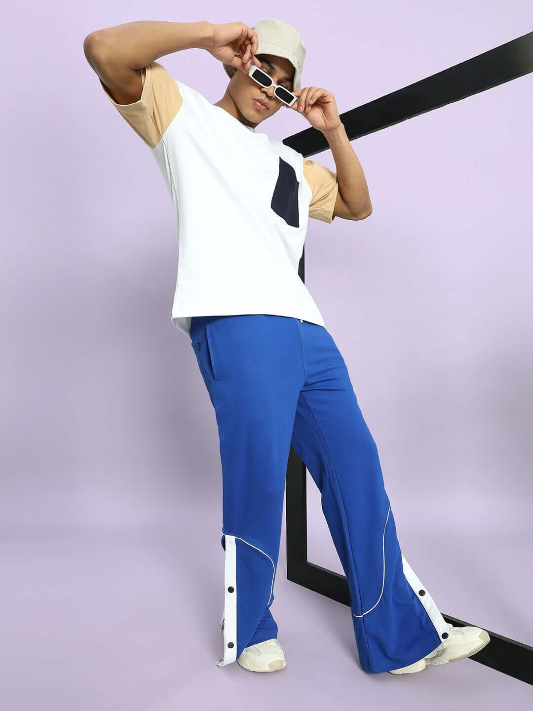 Model wearing EDDIE CONTRAST JOGGERS in royal blue, stylish casual wear with customizable fit options for personalized comfort.