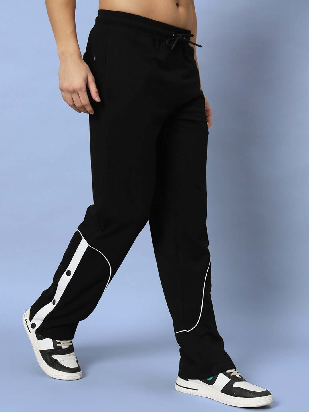 Model wearing EDDIE CONTRAST JOGGERS in black, made to order with customization option, designed by DUDS.