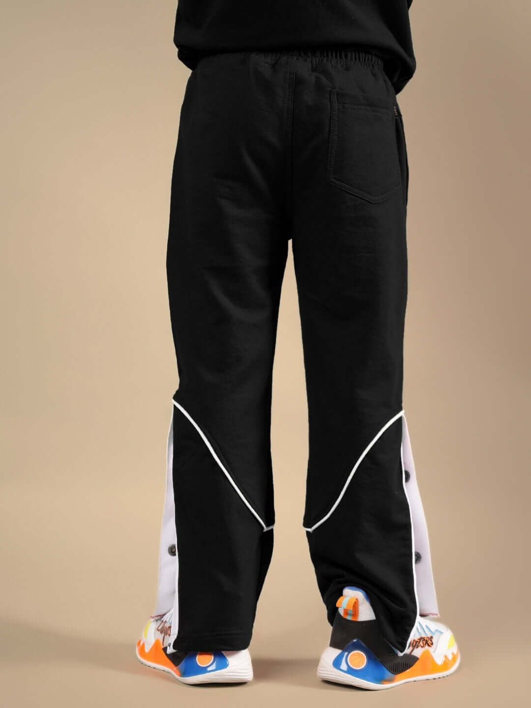 Rear view of EDDIE JOGGER FOR BOYS & GIRLS BLACK showing design and fit.