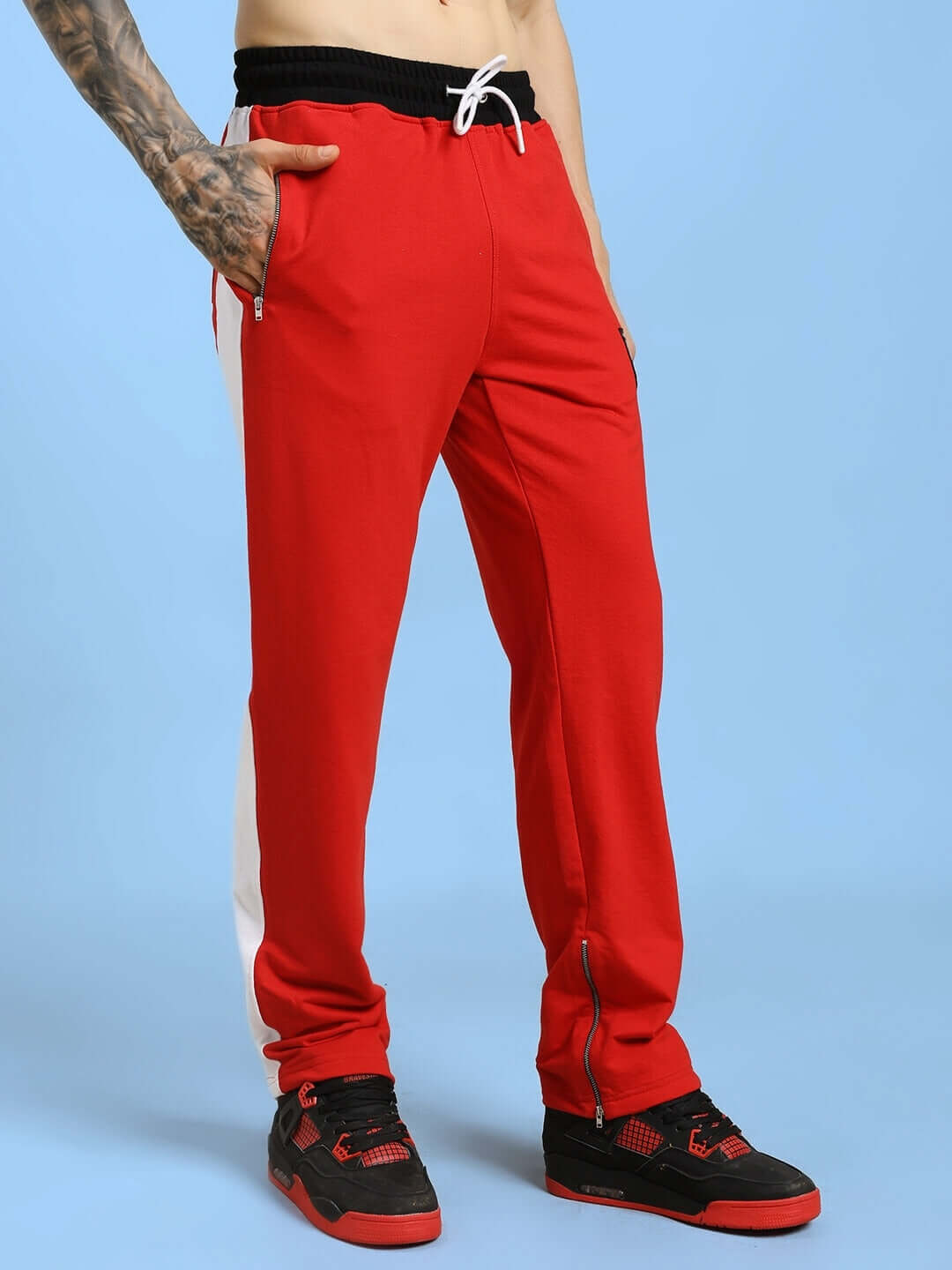 Man wearing Elegant Relaxed-Fit Joggers Red, showcasing comfortable style with premium cotton blend fabric and relaxed-fit silhouette.