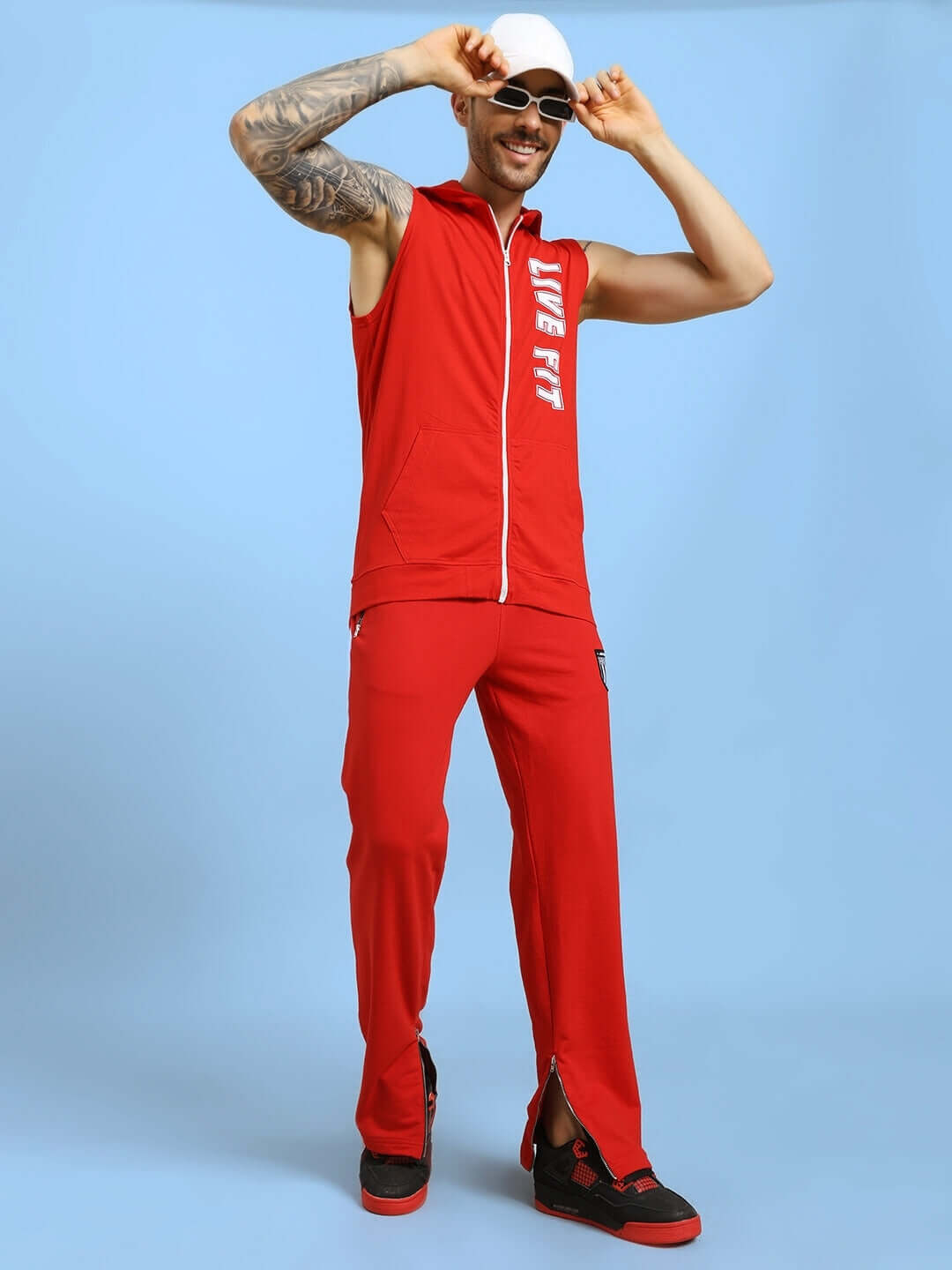 ELEGANT RELAXED-FIT JOGGERS RED on model showcasing style and comfort with modern relaxed-fit design.