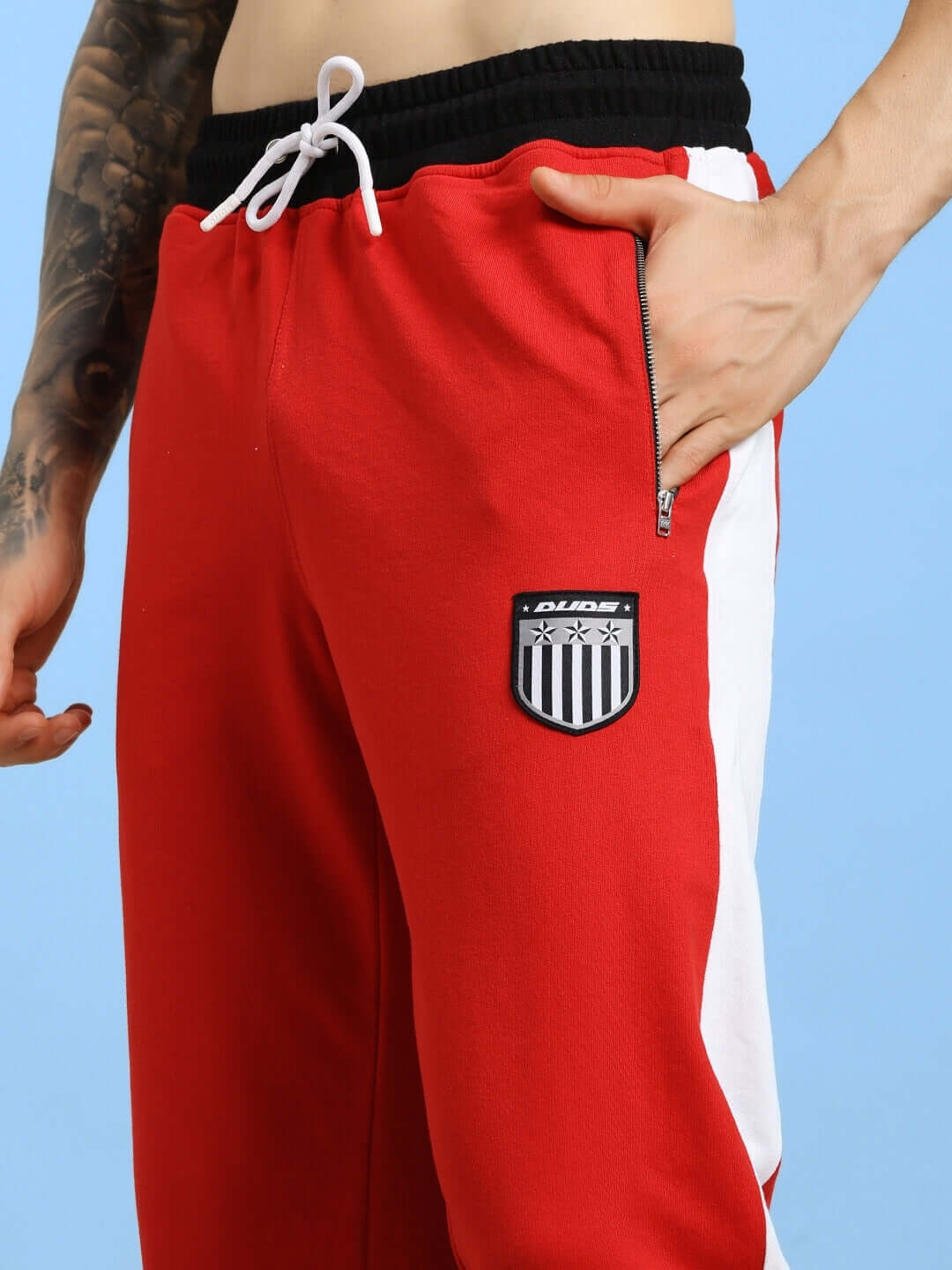 ELEGANT RELAXED-FIT JOGGERS RED showcasing breathable cotton blend fabric and relaxed-fit silhouette for comfort and style.