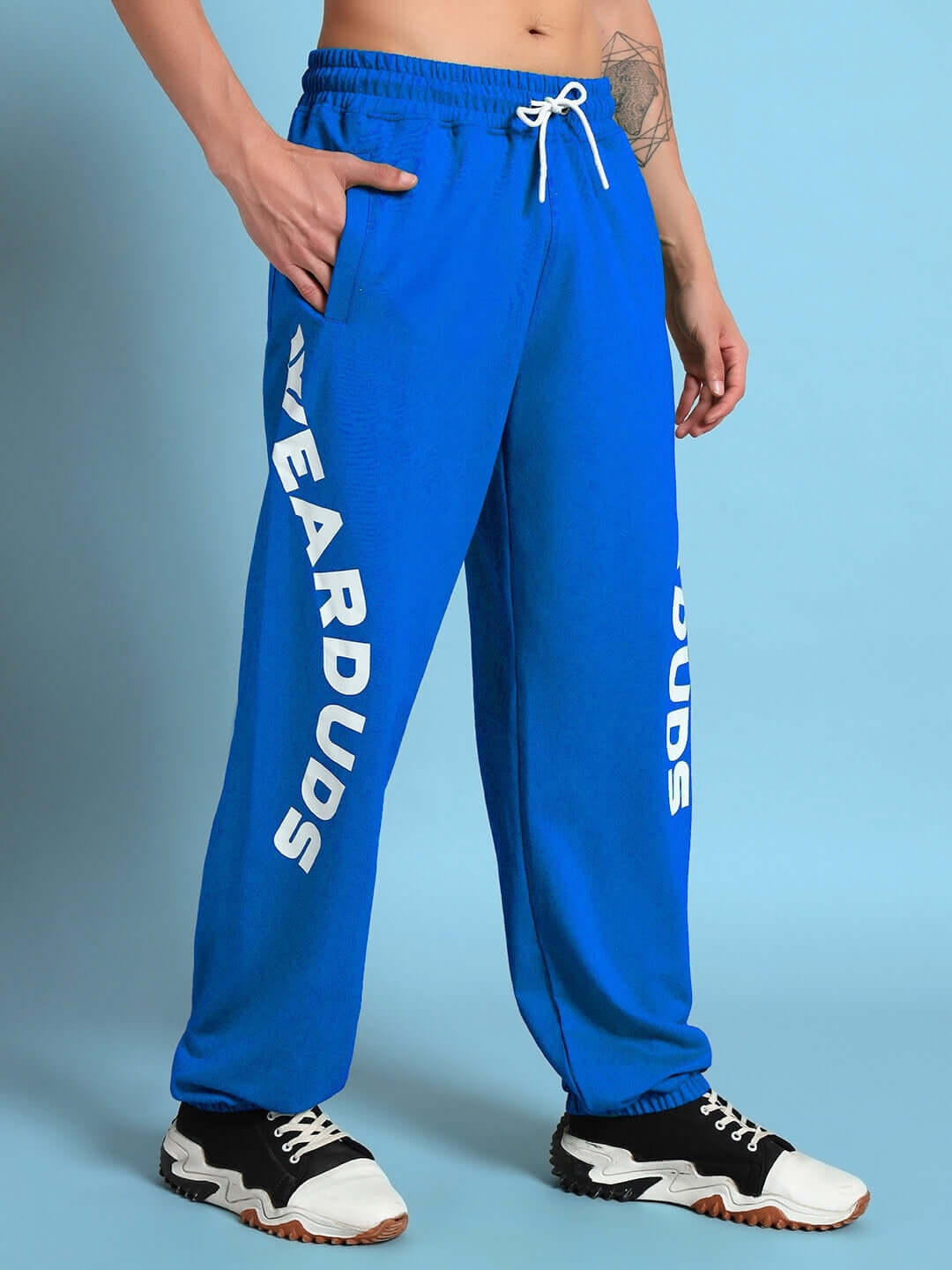 ELLEN RELAXED FIT JOGGER BLUE with bold logo on model.