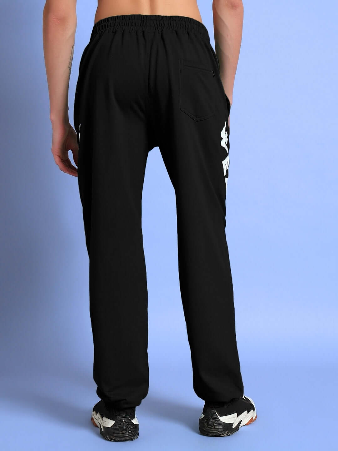 Rear view of ELLEN RELAXED FIT JOGGER BLACK showcasing relaxed silhouette and pockets, perfect for streetwear fashion.