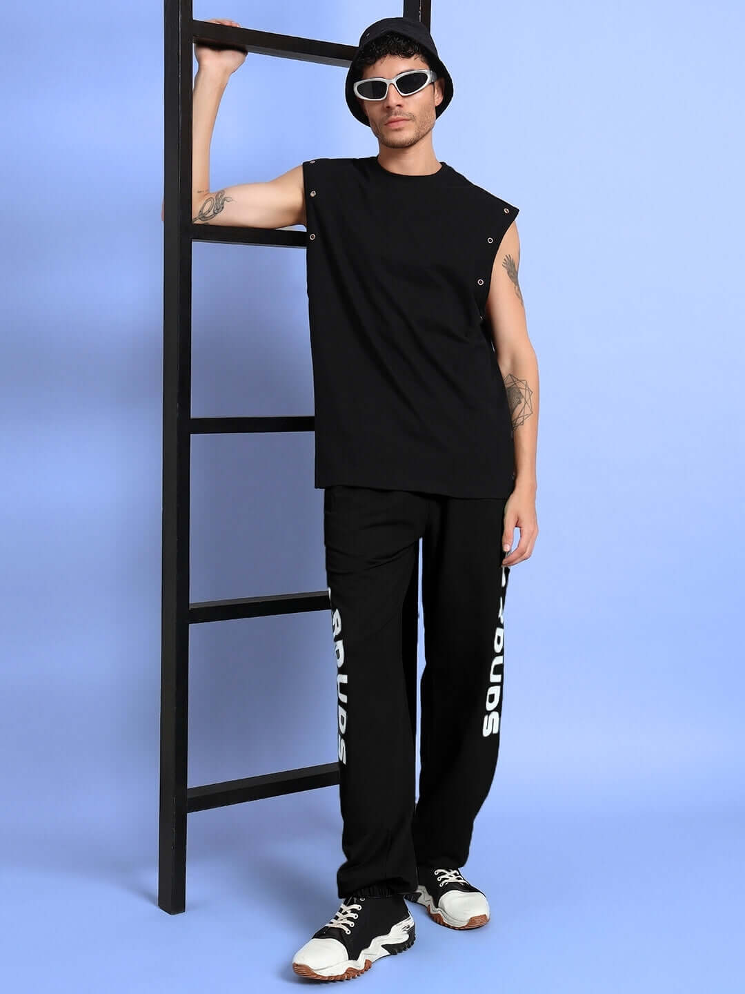 Model wearing ELLEN RELAXED FIT JOGGER BLACK with streetwear style and sunglasses