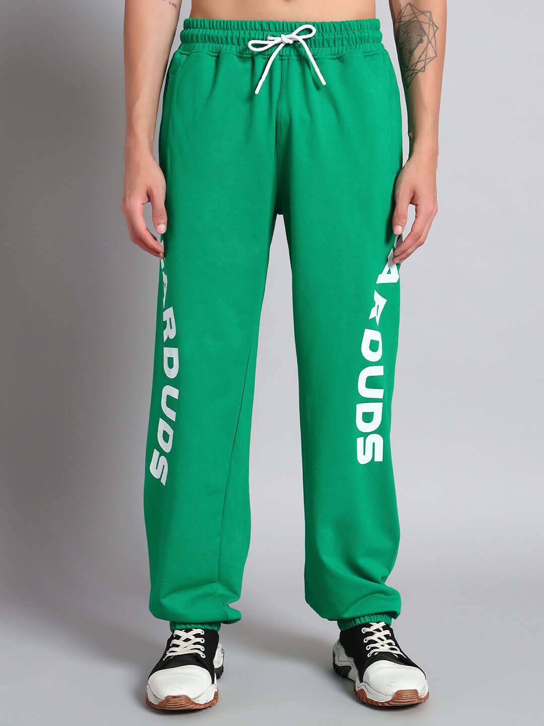 Person wearing ELLEN RELAXED FIT JOGGER GREEN by DUDS, showcasing its flexible design and vibrant color.