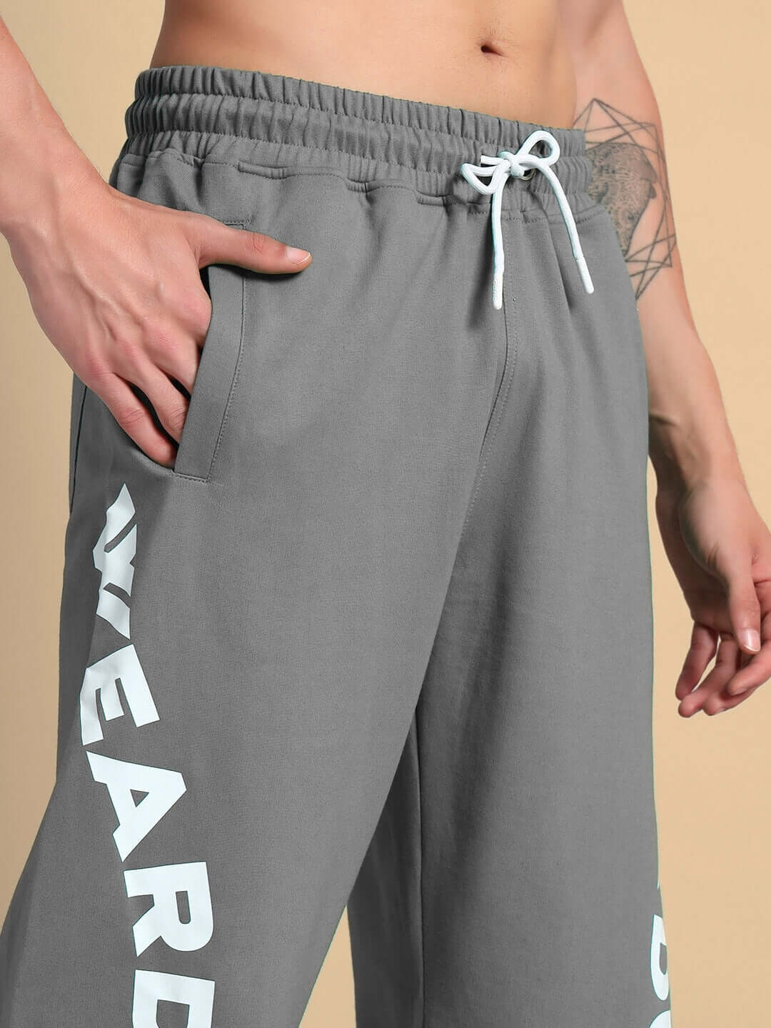 Person wearing ELLEN RELAXED FIT JOGGER GREY with hand in pocket, showcasing soft, durable cotton-blend fabric in neutral grey.