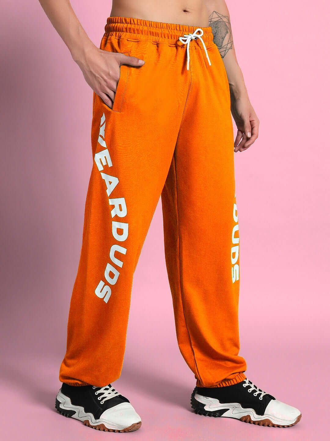 Model wearing ELLEN RELAXED FIT JOGGER ORANGE with vibrant style and comfortable fit.
