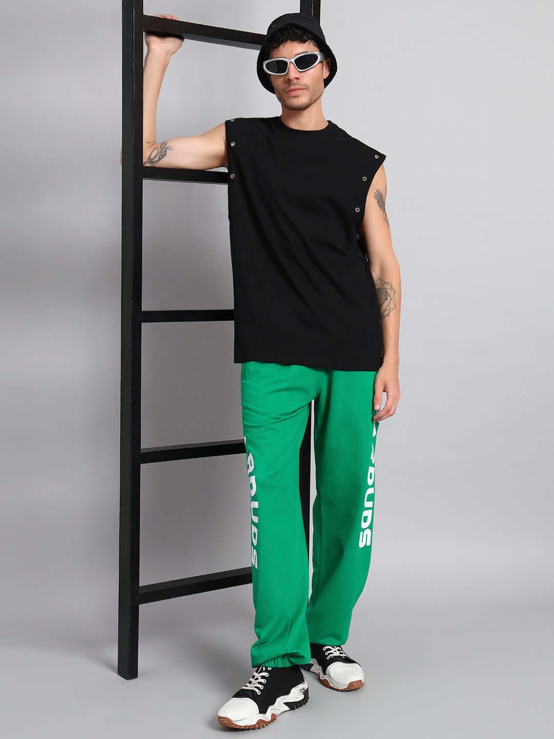 Model wearing ELLEN RELAXED FIT JOGGER GREEN with black sleeveless top and black accessories.