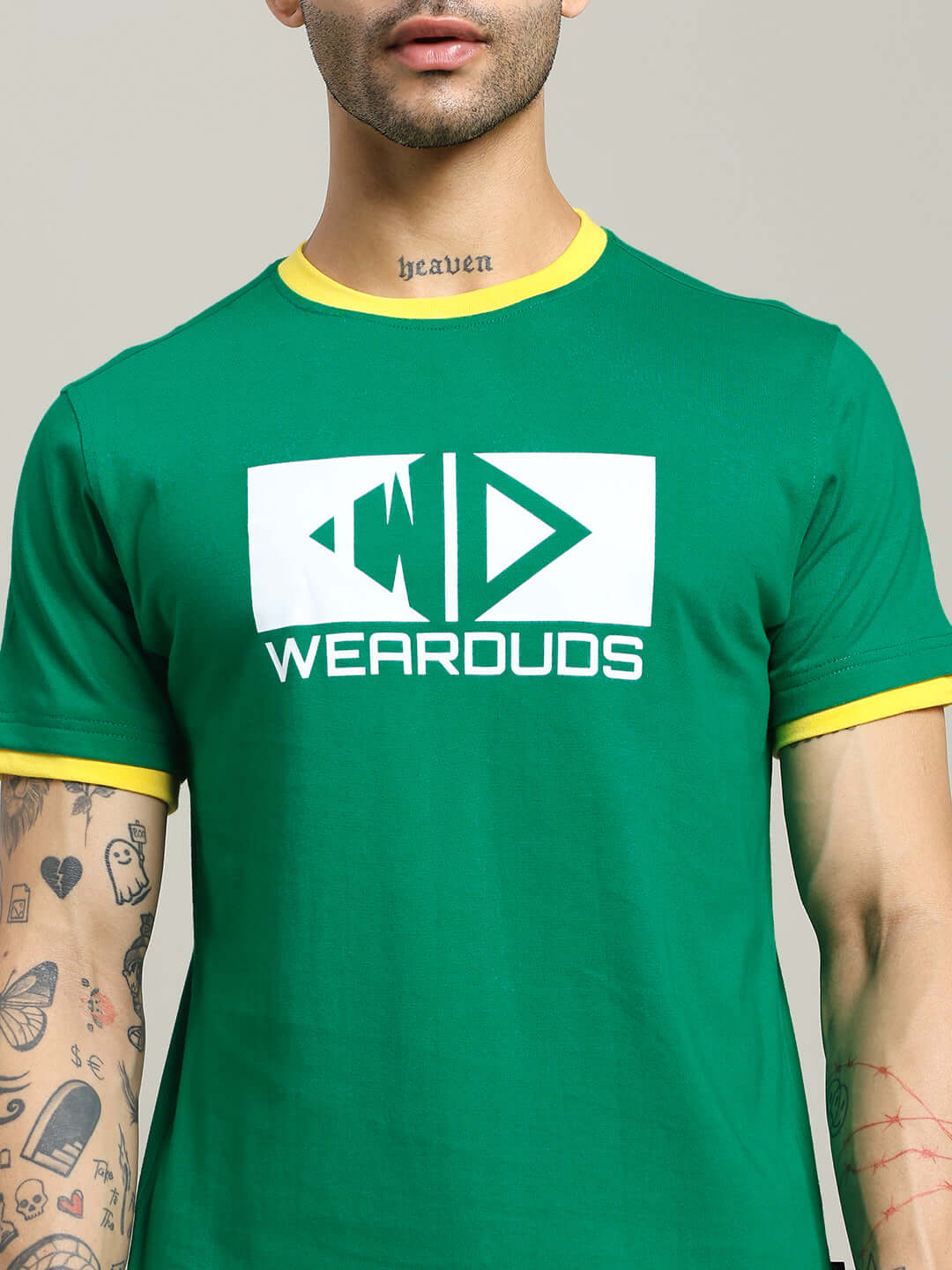 Model wearing ELMER REGULAR FIT T-SHIRT GREEN with logo, showcasing premium cotton fabric for comfort and style.