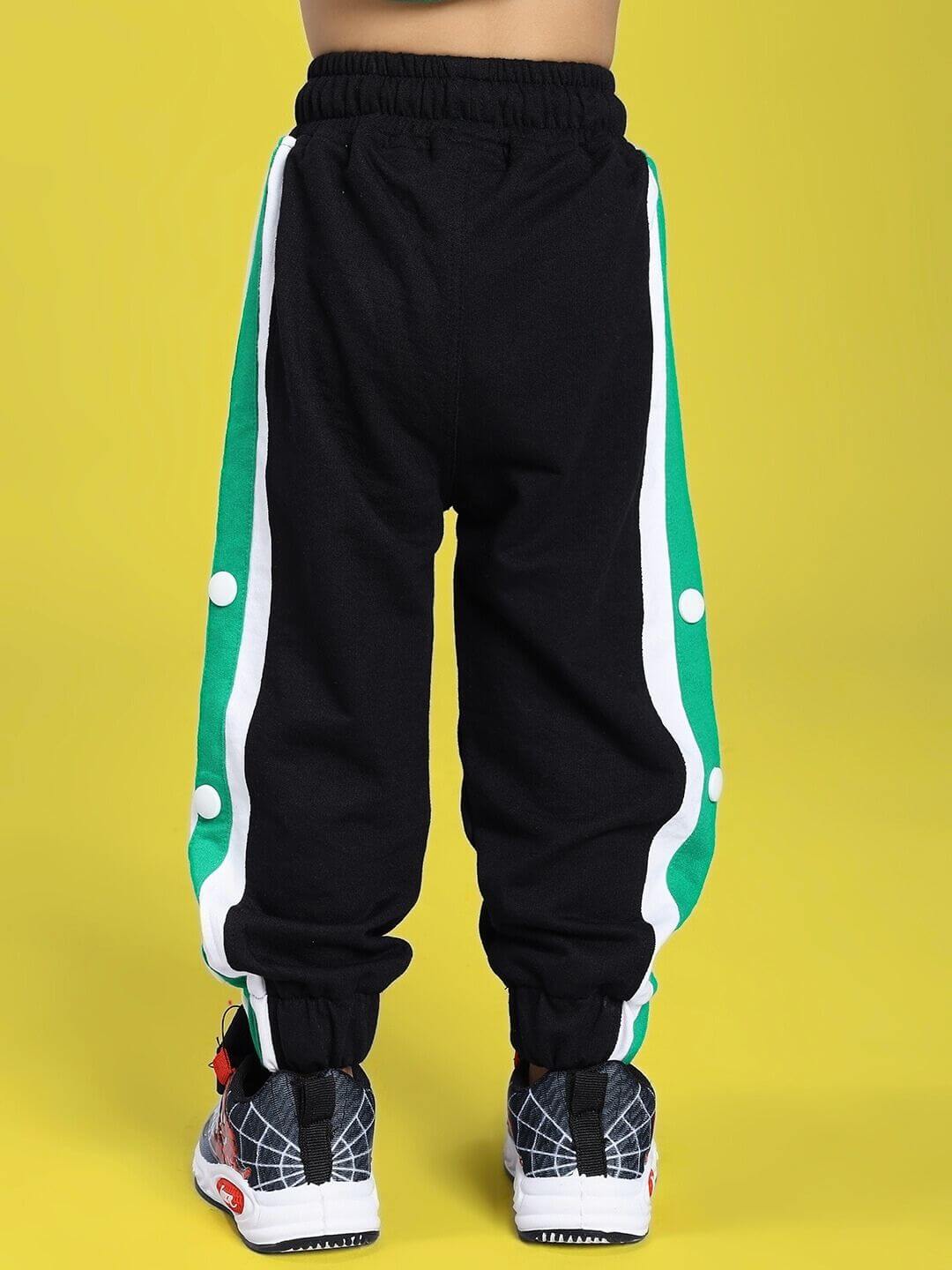 EMIRATI JOGGER FOR BOYS AND GIRLS BLACK GREEN with side stripe detail, perfect for casual wear.