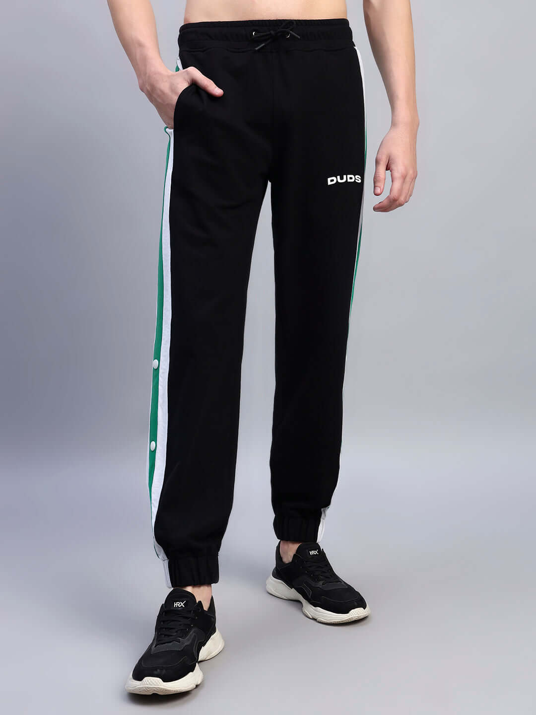 EMIRATI STRIPES JOGGERS BLACK-GREEN with green side stripes on black base, perfect for casual outings or workouts.