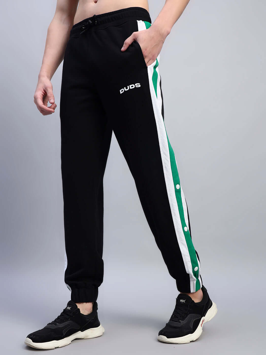 EMIRATI STRIPES JOGGERS BLACK-GREEN with green side stripes and sleek design for streetwear and comfort.