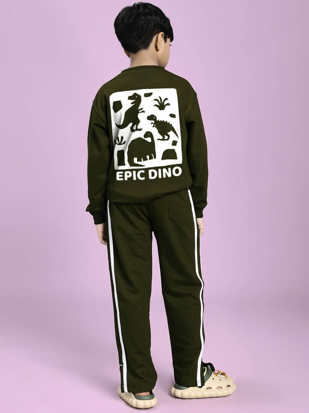 Child wearing EPIC DINO CO-ORD FOR BOYS GIRLS OLIVE GREEN outfit with dinosaur print, perfect for playful style and comfort.