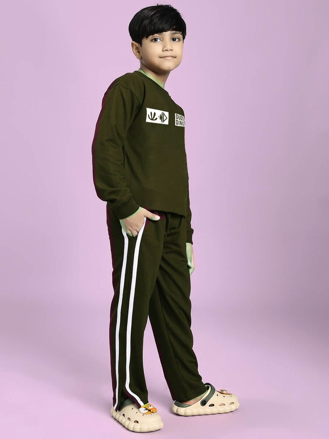 EPIC DINO CO-ORD FOR BOYS GIRLS OLIVE GREEN set with dinosaur design on child model with matching top and bottom.