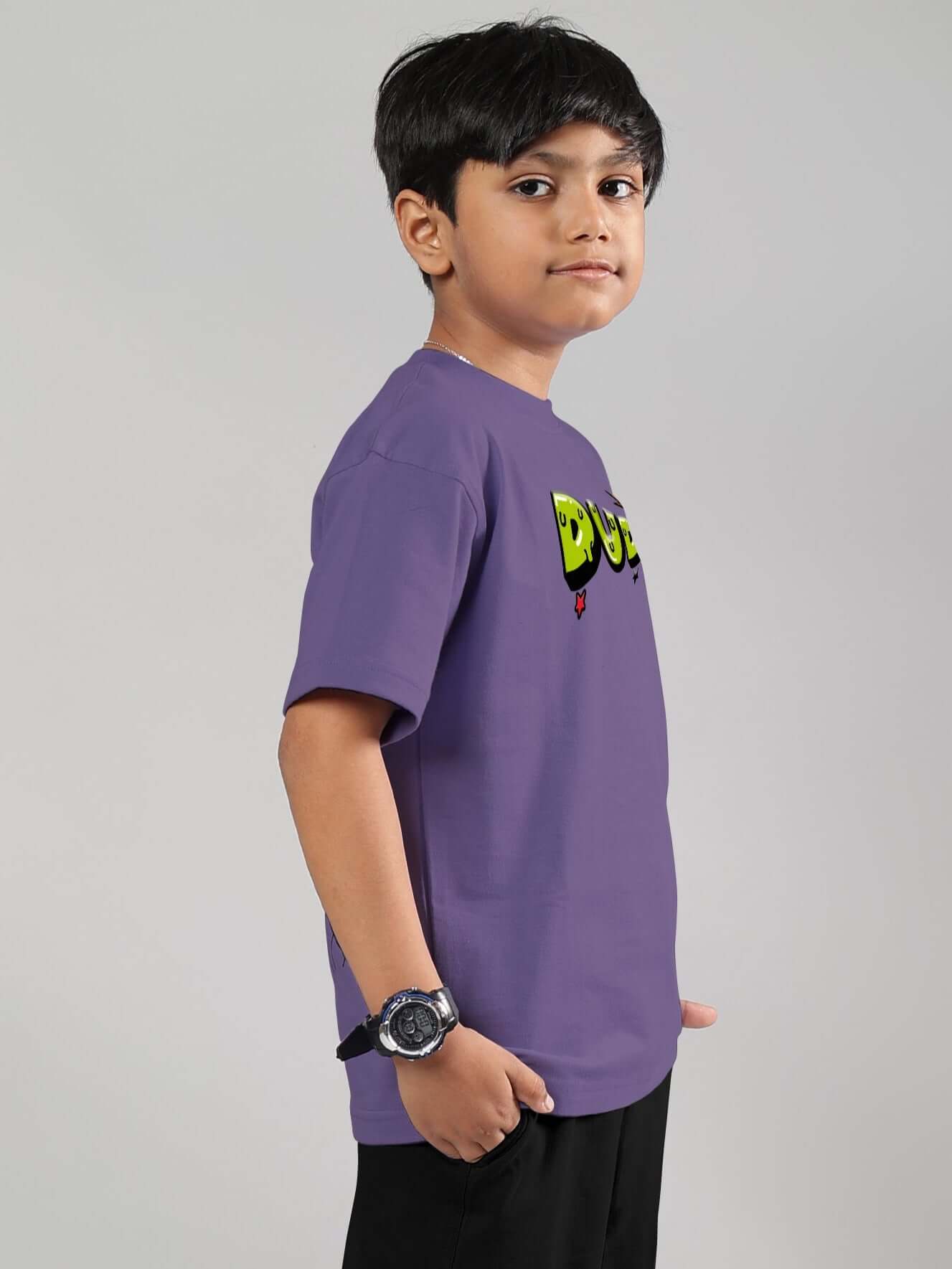 Boy wearing ESCAPED TWEETY T-SHIRT FOR BOYS GIRLS WISTERIA PURPLE with playful Tweety print, side view