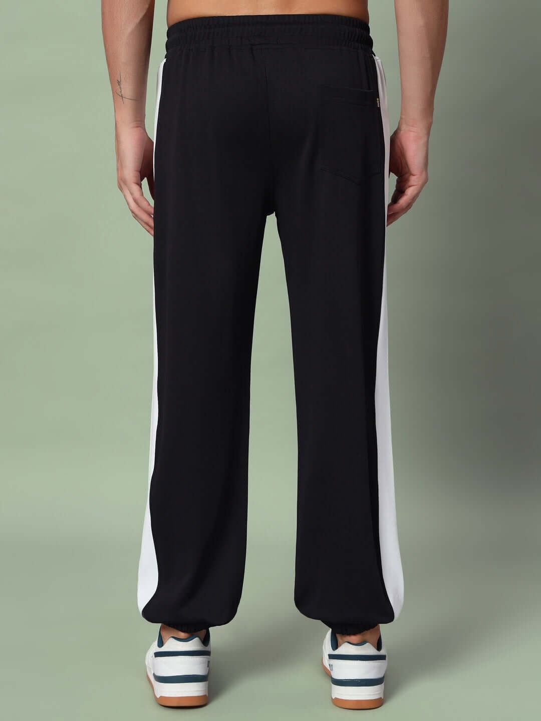 Back view of Euphoria Joggers in black-white, showcasing custom fit option and quality craftsmanship by DUDS tailors.