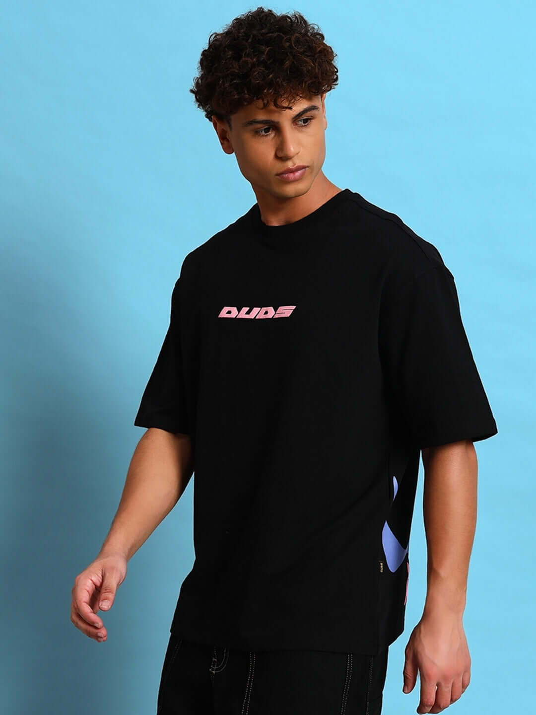 Model wearing EYE BALL PUFF PRINT OVER-SIZED T-SHIRT BLACK, featuring bold streetwear design and striking puff print.