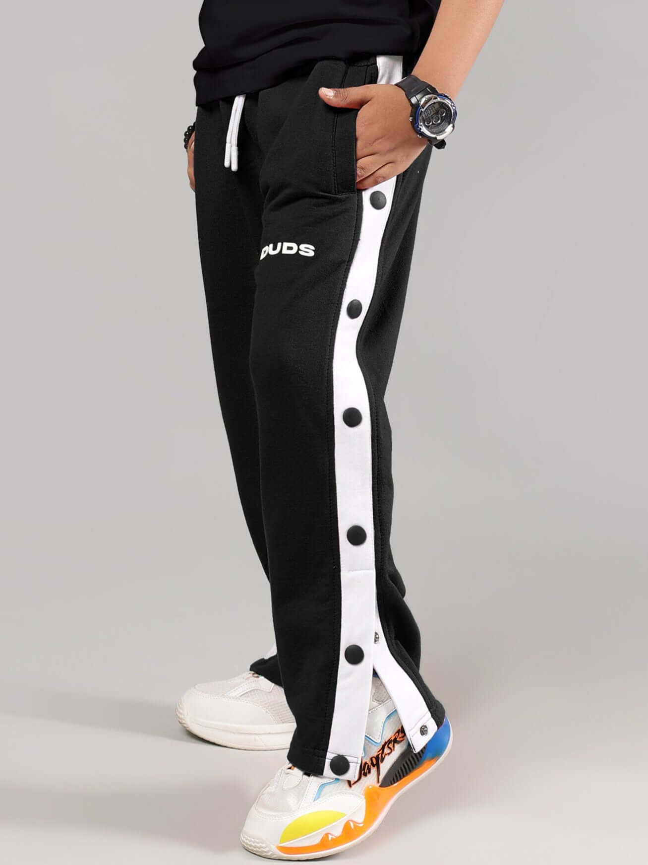 EZEL JOGGER FOR BOYS & GIRLS BLACK with side button detailing, perfect casual wear for children, showcasing custom fit and comfortable design.