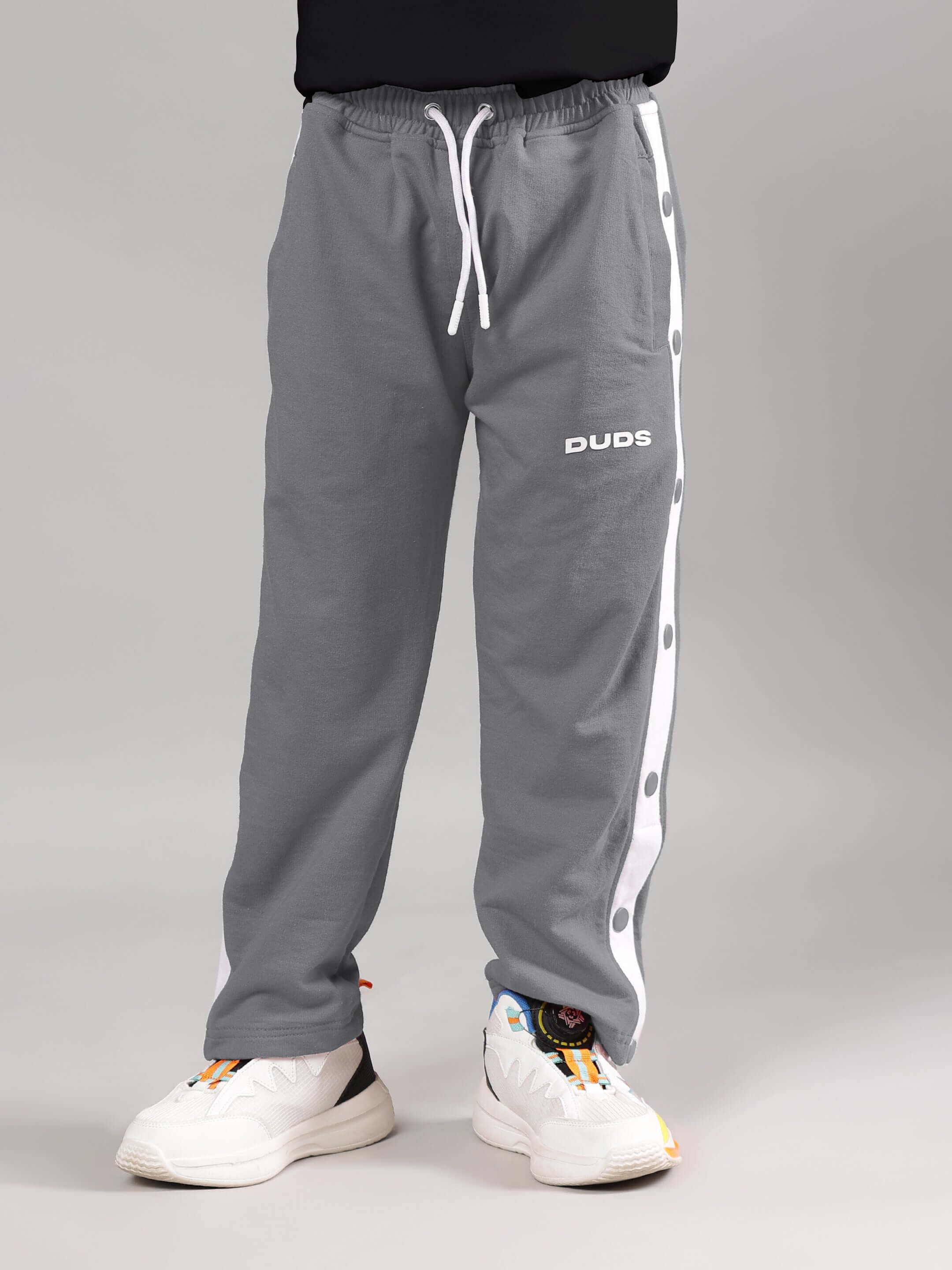 EZEL JOGGER FOR BOYS & GIRLS GREY with drawstring, side buttons, and DUDS branding, designed for comfortable fit.