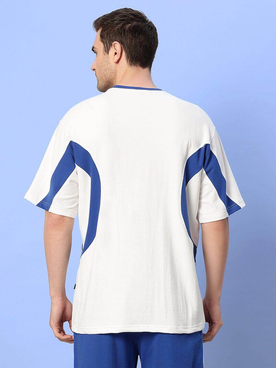 Back view of EZEL OVER-SIZED T-SHIRT WHITE-BLUE on male model showcasing stylish design and premium cotton fabric.