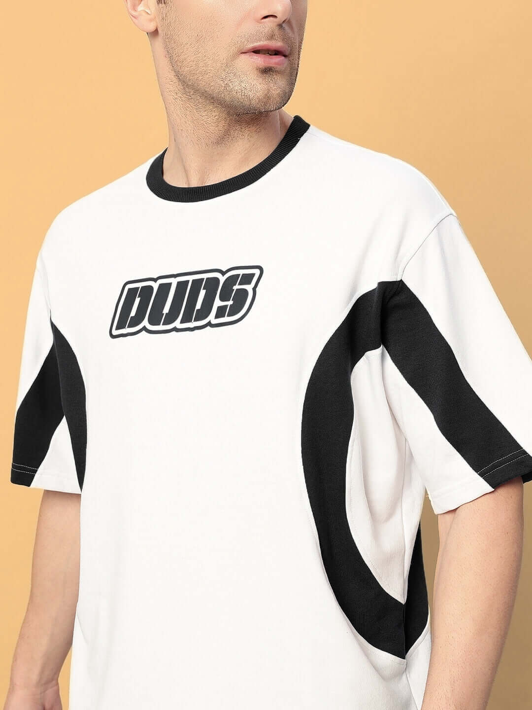 Man wearing EZEL OVER-SIZED T-SHIRT BLACK WHITE, featuring bold streetwear style with premium breathable cotton material.