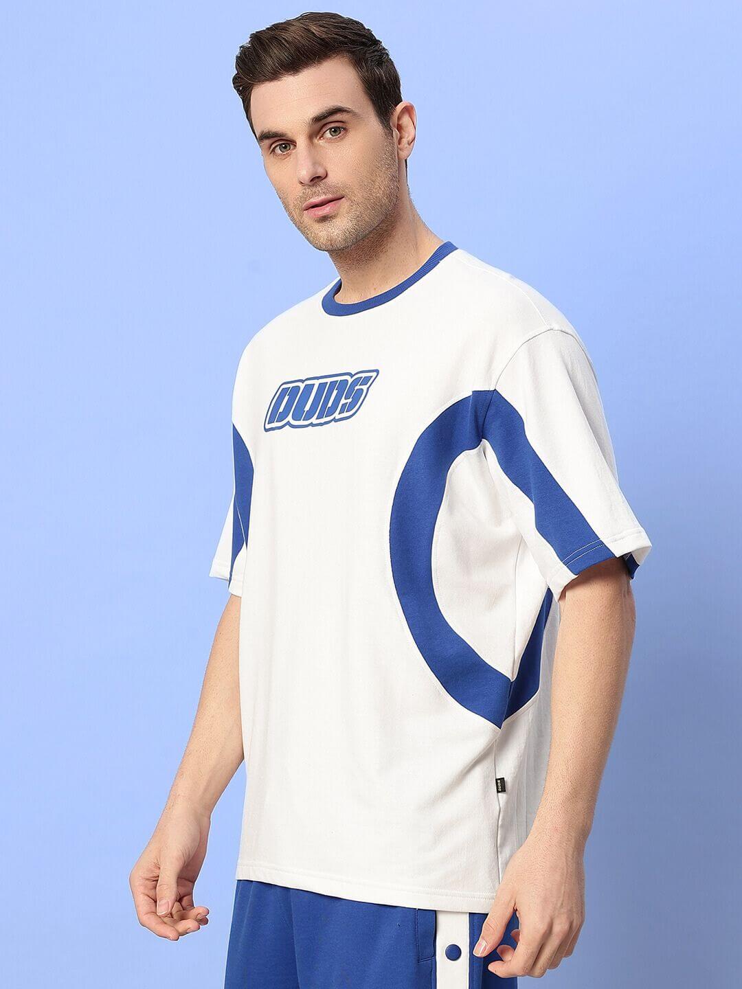 Man wearing EZEL OVER-SIZED T-SHIRT WHITE-BLUE, premium cotton, streetwear fashion.