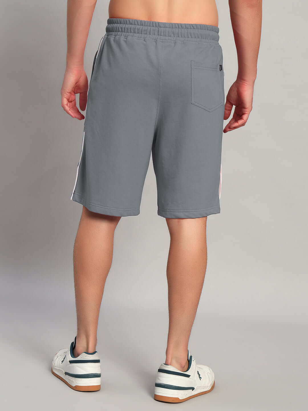 Back view of EZEL REGULAR FIT COTTON SHORTS GREY on a person, highlighting comfortable style for casual occasions.