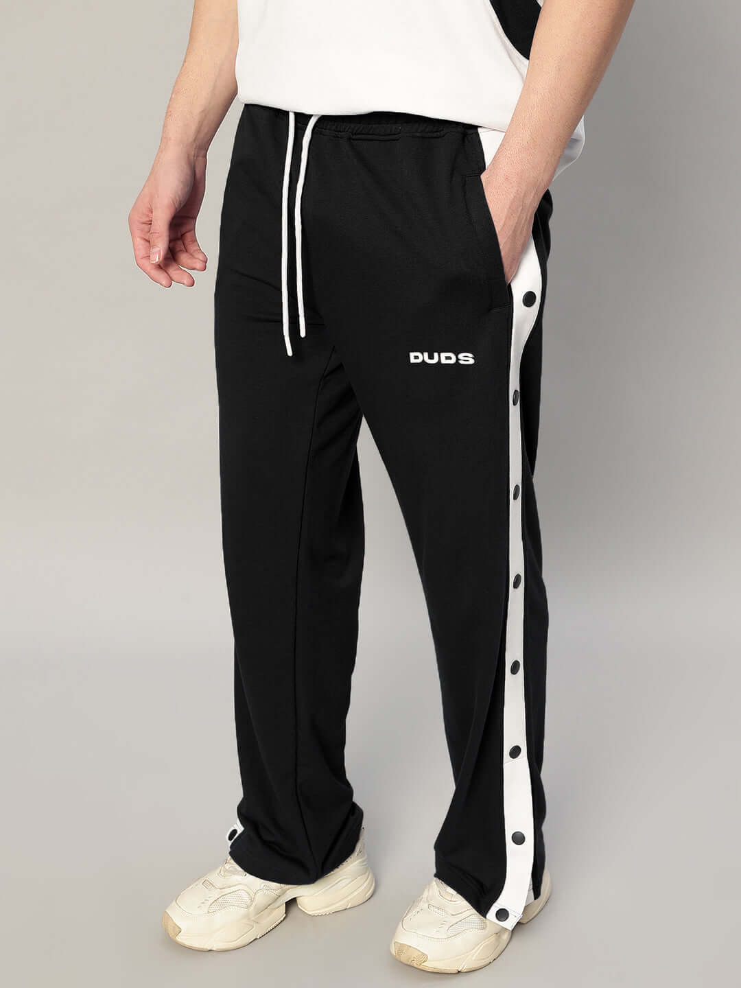EZEL Relaxed Fit Jogger in black with white trim by DUDS, featuring a custom fit option. Stylish, made-to-order joggers for comfort.