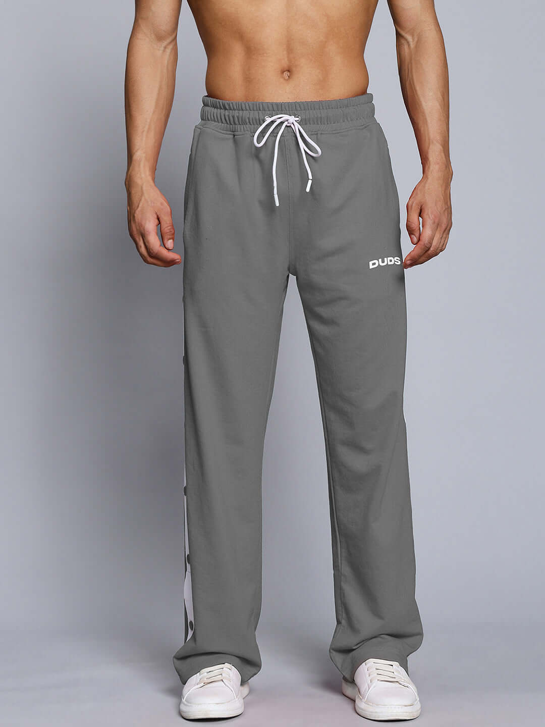 Person wearing EZEL RELAXED FIT CO-ORD SET WHITE-GREY joggers with elastic waistband and drawstring.