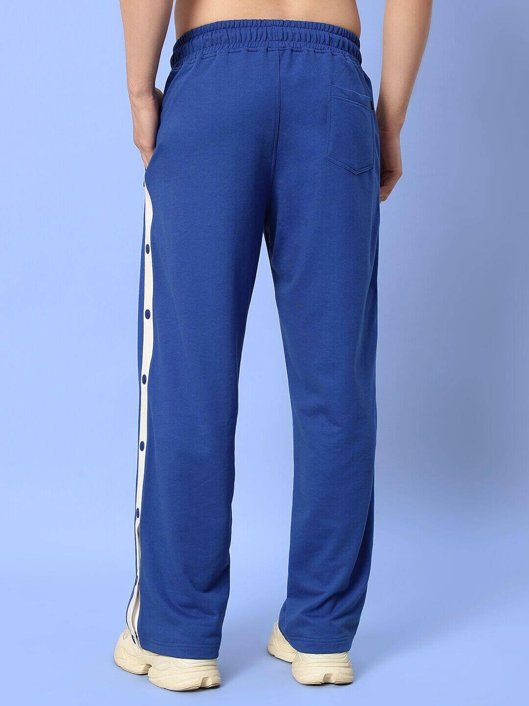 Back view of blue EZEL Relaxed Fit Jogger featuring comfortable fit with side stripes, tailored by experienced tailors at DUDS.